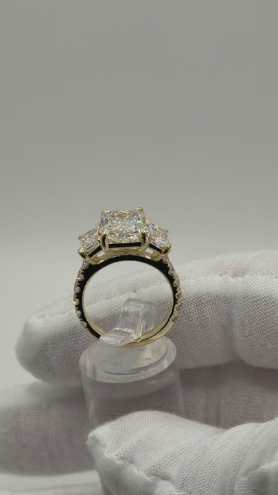 Three-stone radiant diamond engagement ring in 14k gold, rotating video