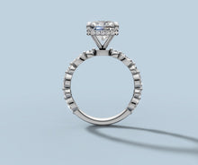 Load image into Gallery viewer, Front view of radiant diamond engagement ring showing the hidden halo beneath the center and the bezel-set band in 14k white gold
