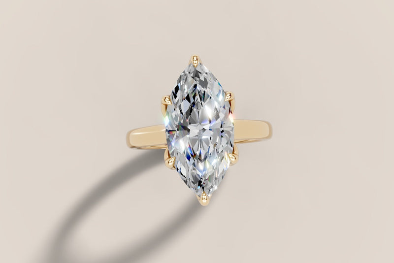 Marquise diamond solitaire ring in 14k gold